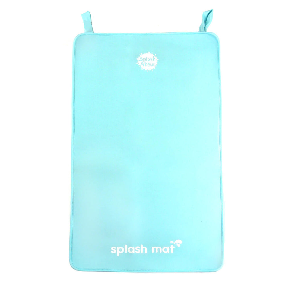 Blue neoprene changing mat on the floor
