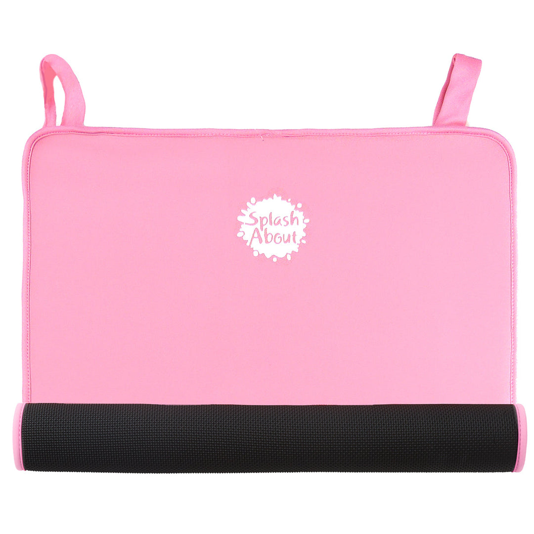 Pink neoprene changing mat, half rolled
