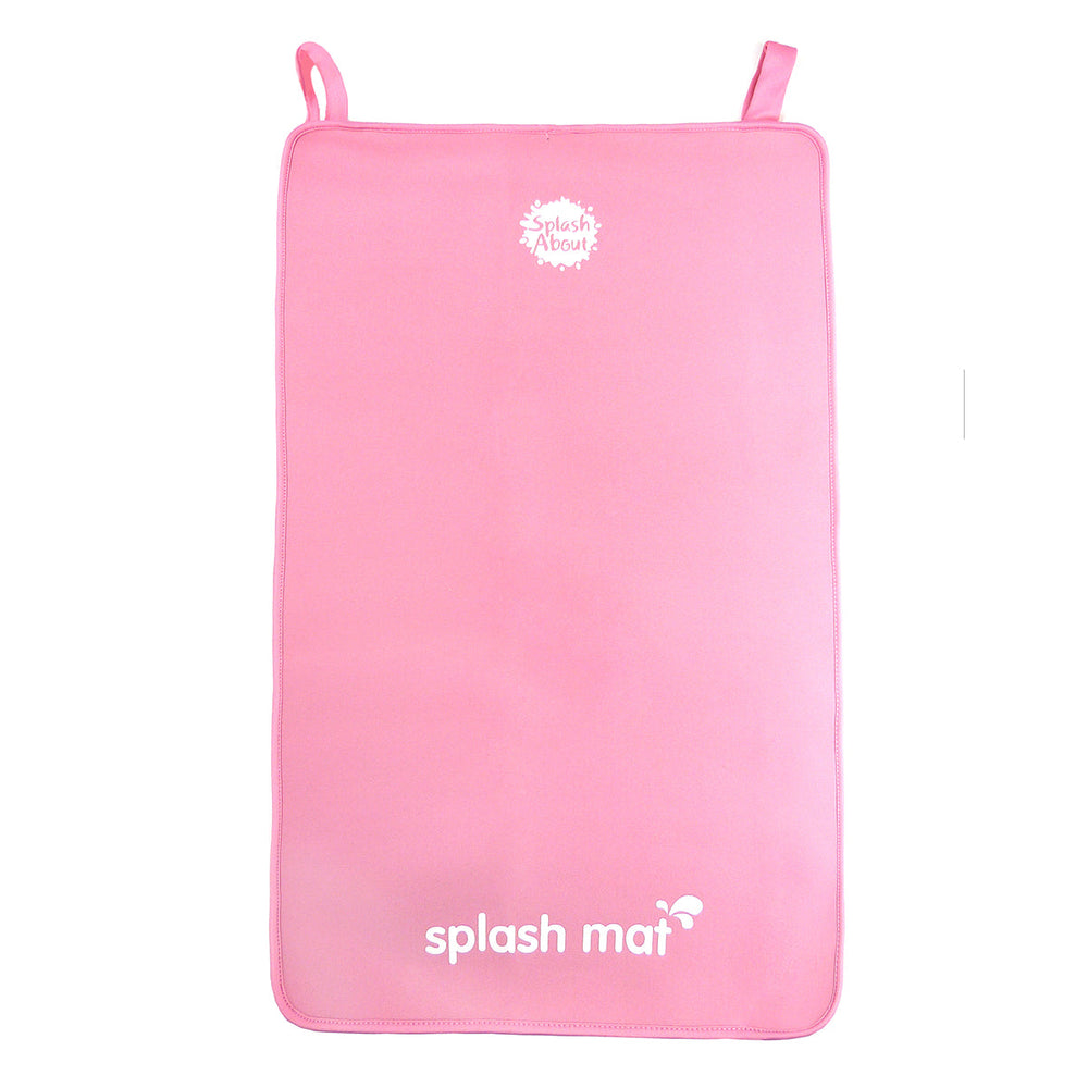 Pink neoprene changing mat on the floor