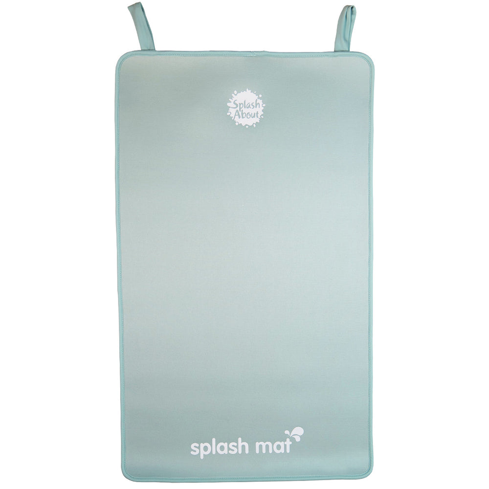 Pistachio neoprene changing mat on the floor