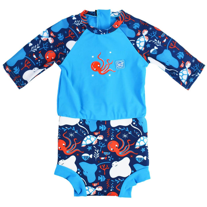 Happy Nappy Sunsuit in navy blue and cyan, with under the sea themed print, including turtles, stingrays, octopus, fish and more. Front.