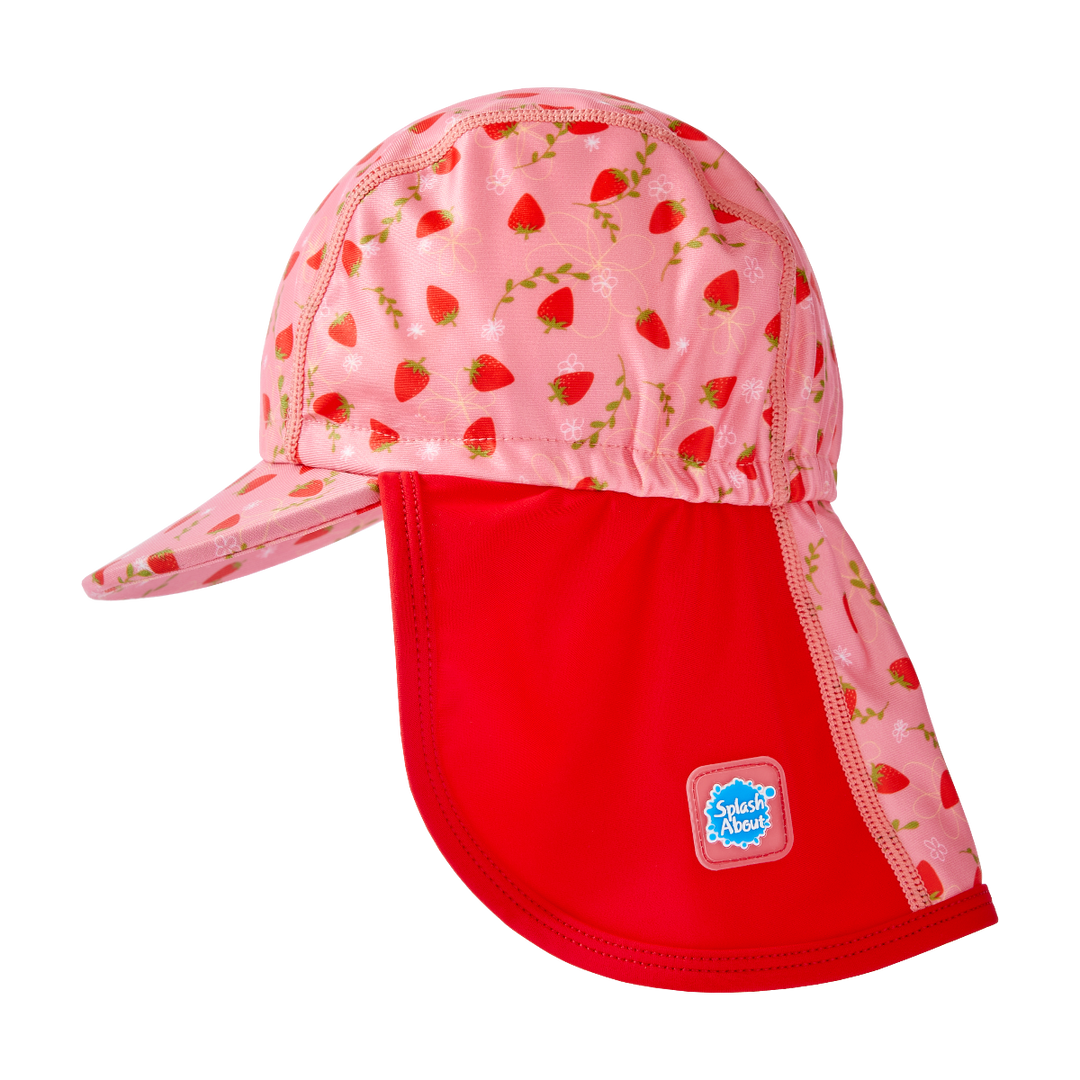 Legionnaire style sun hat in pink and red, with strawberries themed print panel. Side.