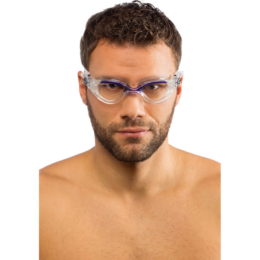 Man wearing clear and blue swim goggles